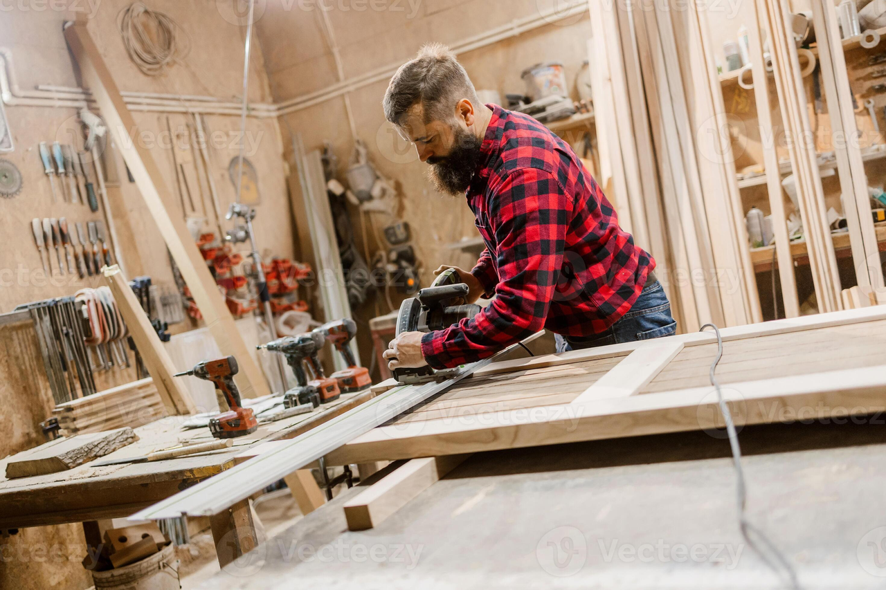 Craftsman working on bench with tools and projects