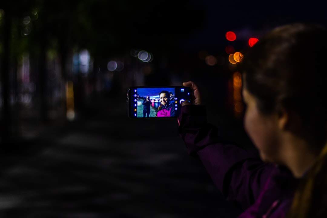 Smartphone night video shoot split-screen: visible grain turning clean