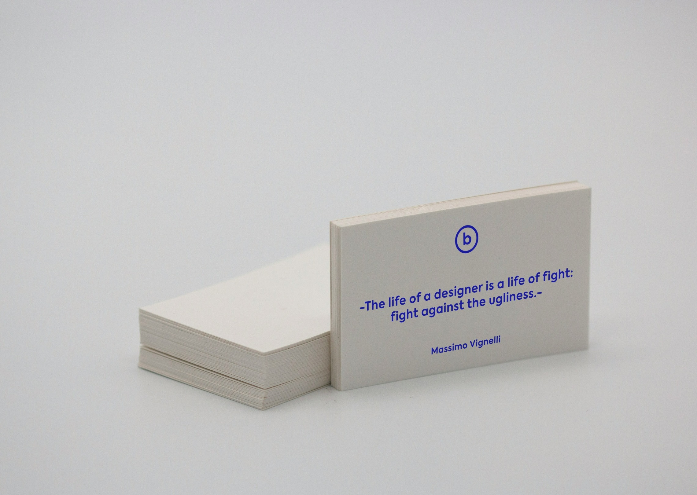 Generate a modern business card with a minimal style using white and blue colors