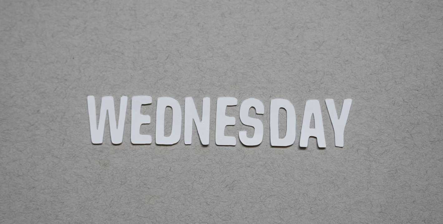 silhouette of standing person under orange sky