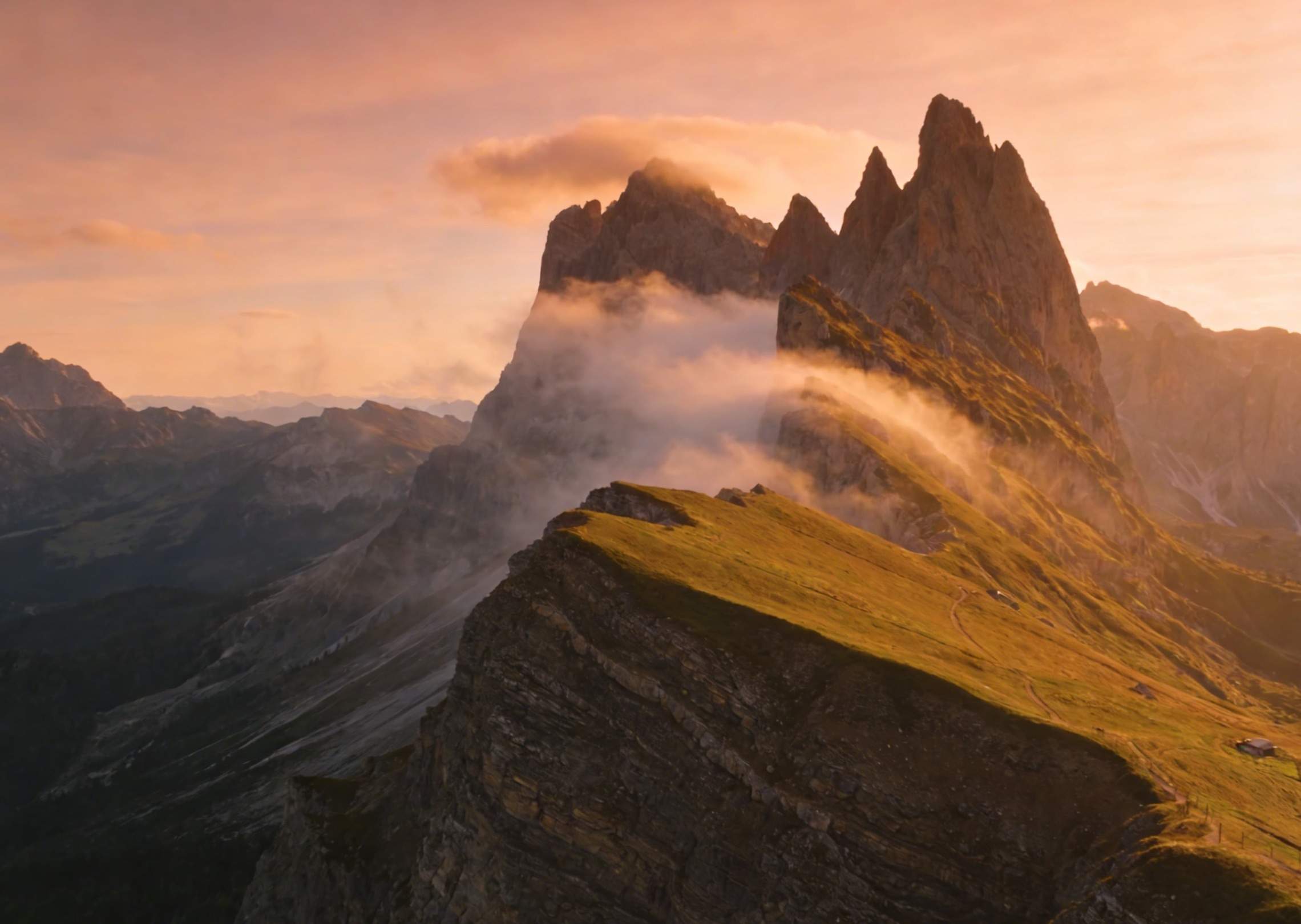 A cinematic sunrise over misty mountains
