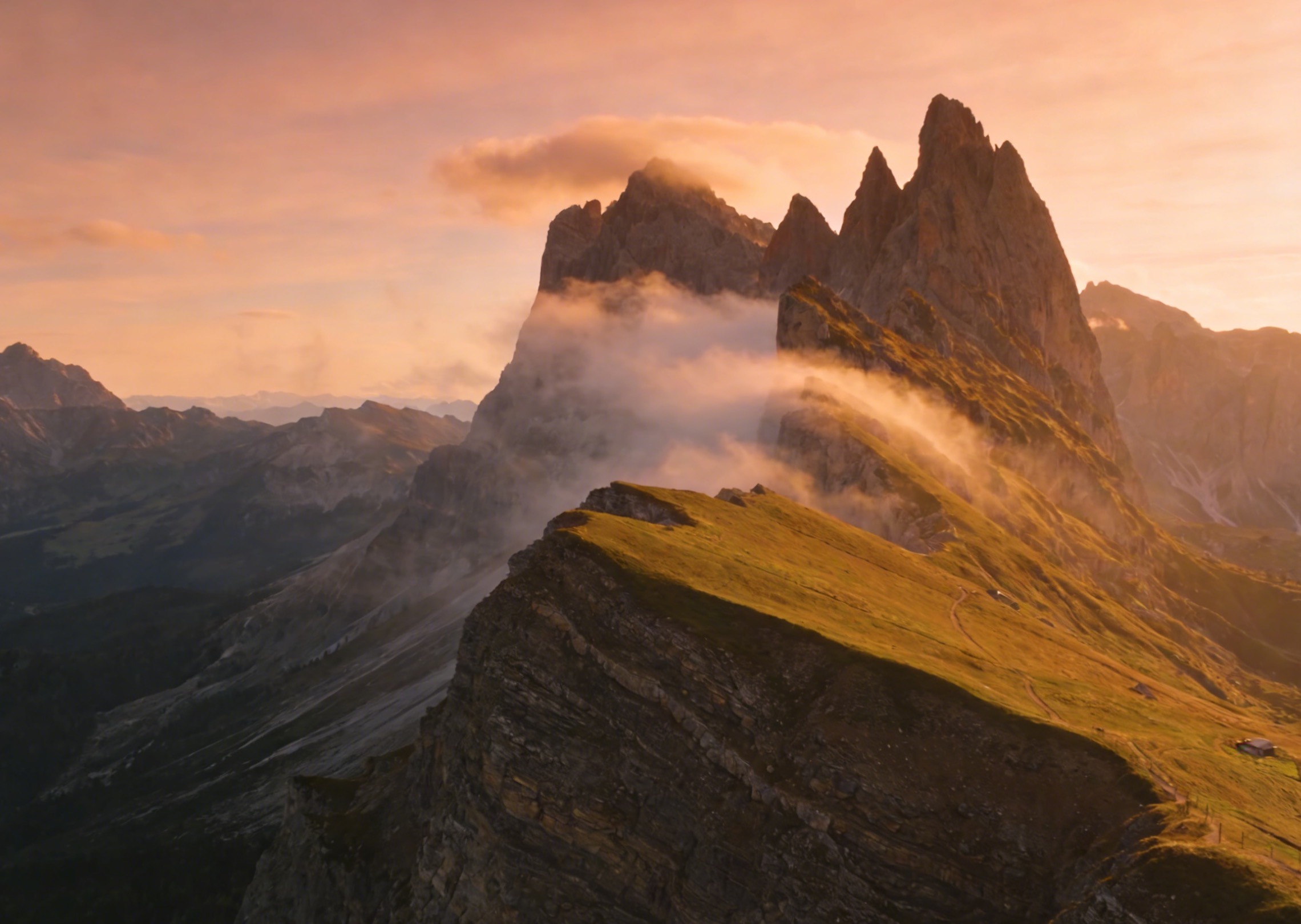 A cinematic sunrise over misty mountains