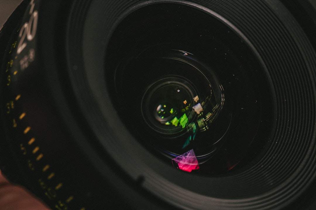 Photographer reviewing images on monitor with color wheel and scopes