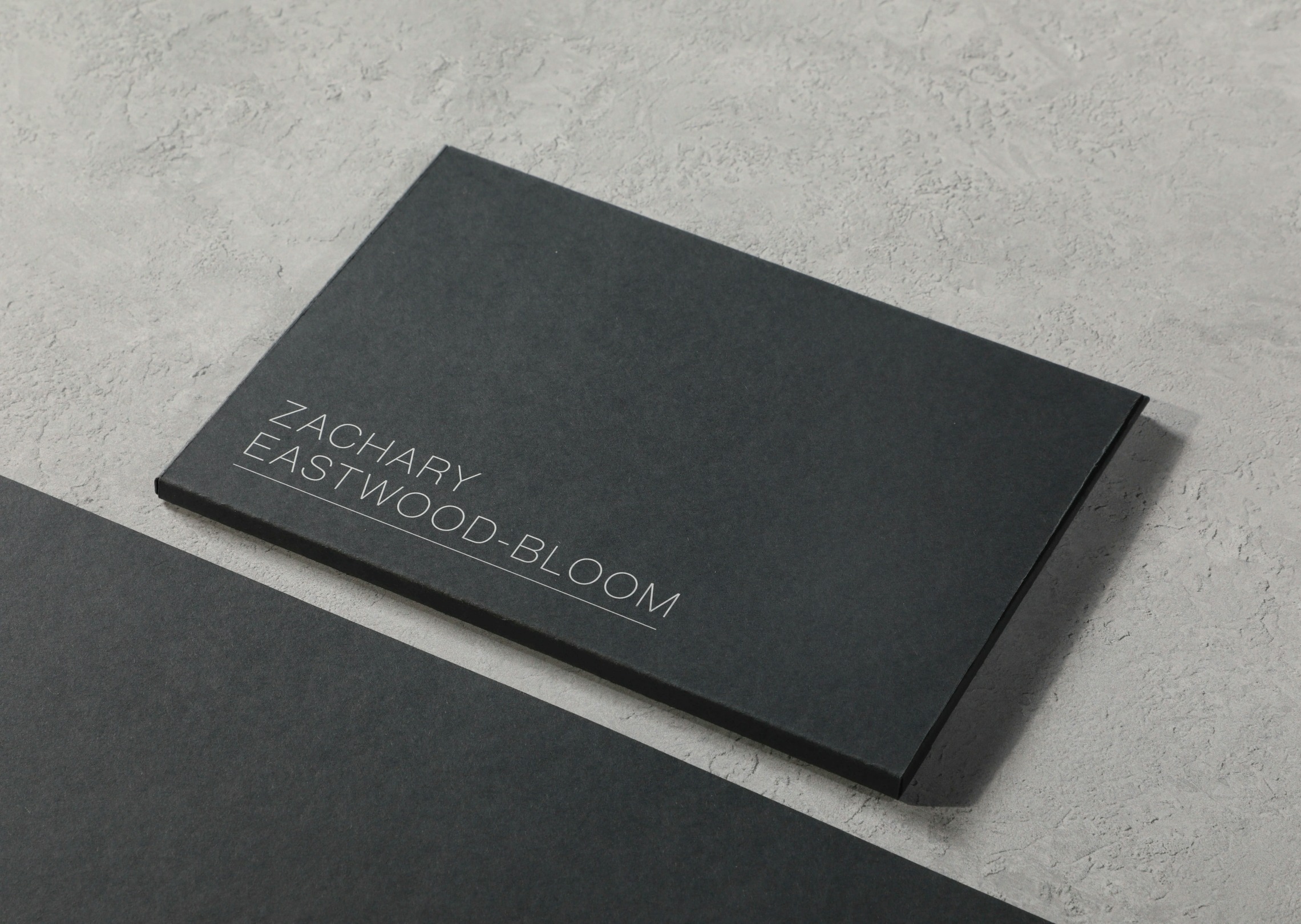 Generate a luxury business card using black and gold colors