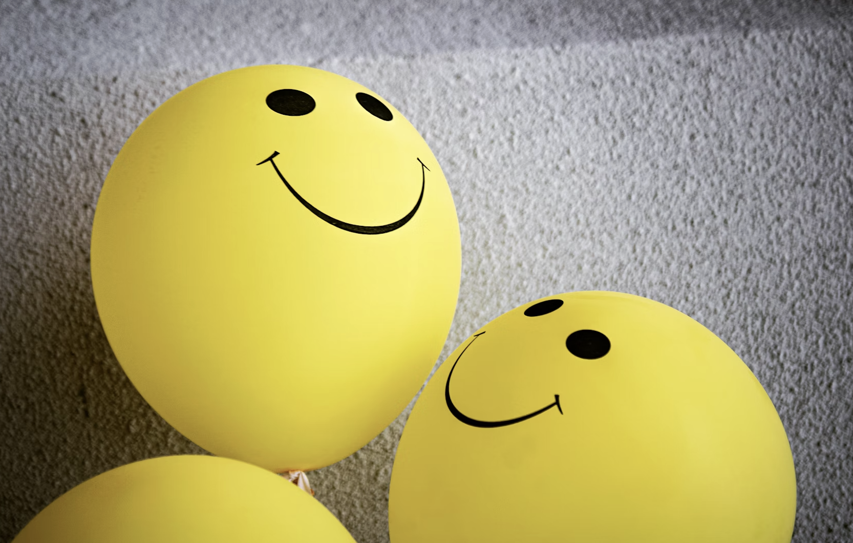 A vibrant and cheerful background with the title "100+ Short Positive Quotes" overlaid.