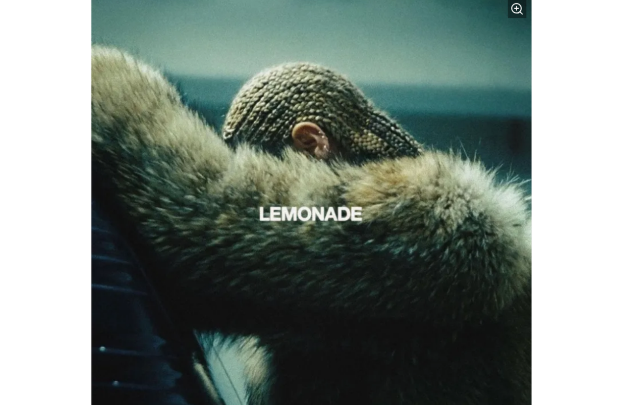 Beyoncé leaning on a Chevrolet suburban in fur coat