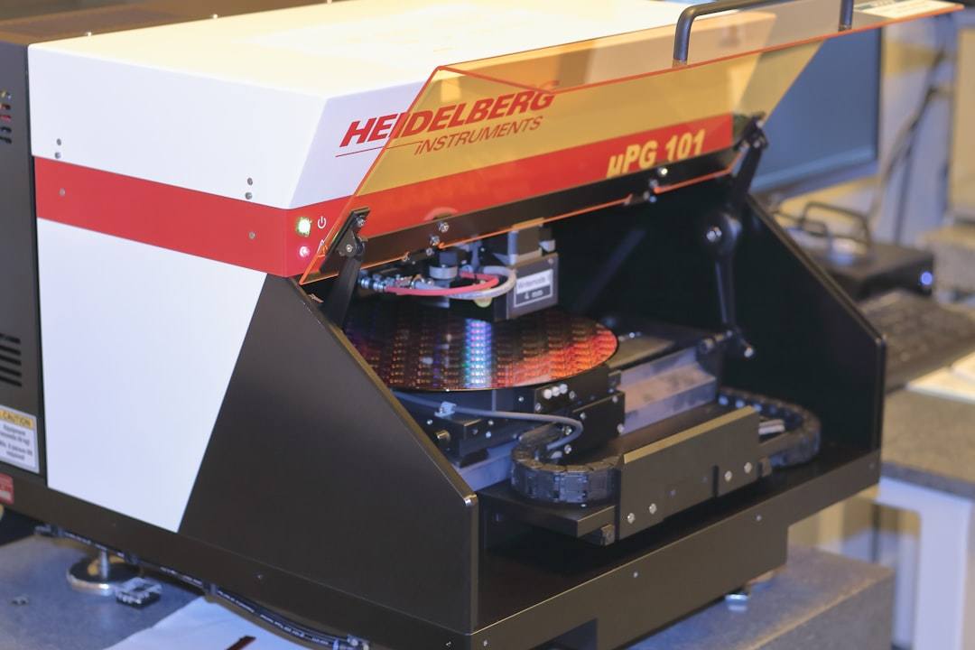Inkjet printer producing Christmas craft printables on a wooden desk
