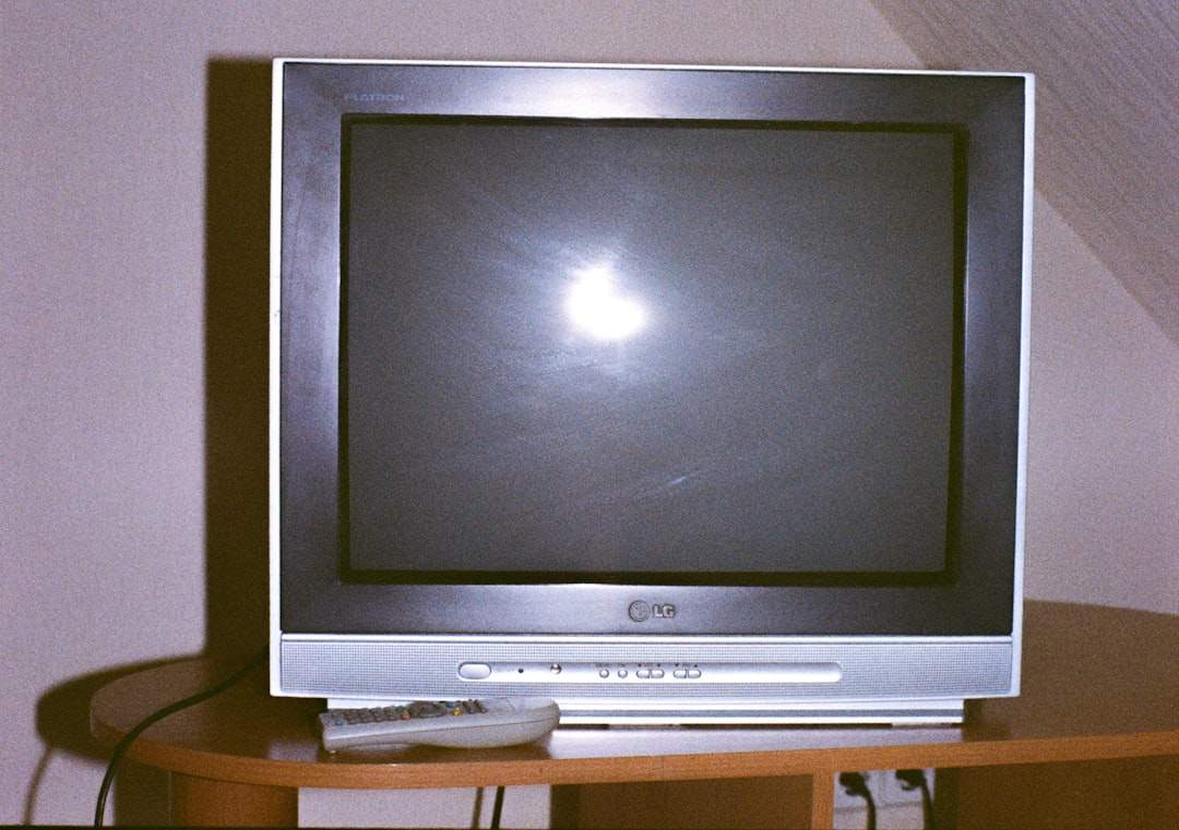 An icon showing a large video file being shrunk into a smaller one