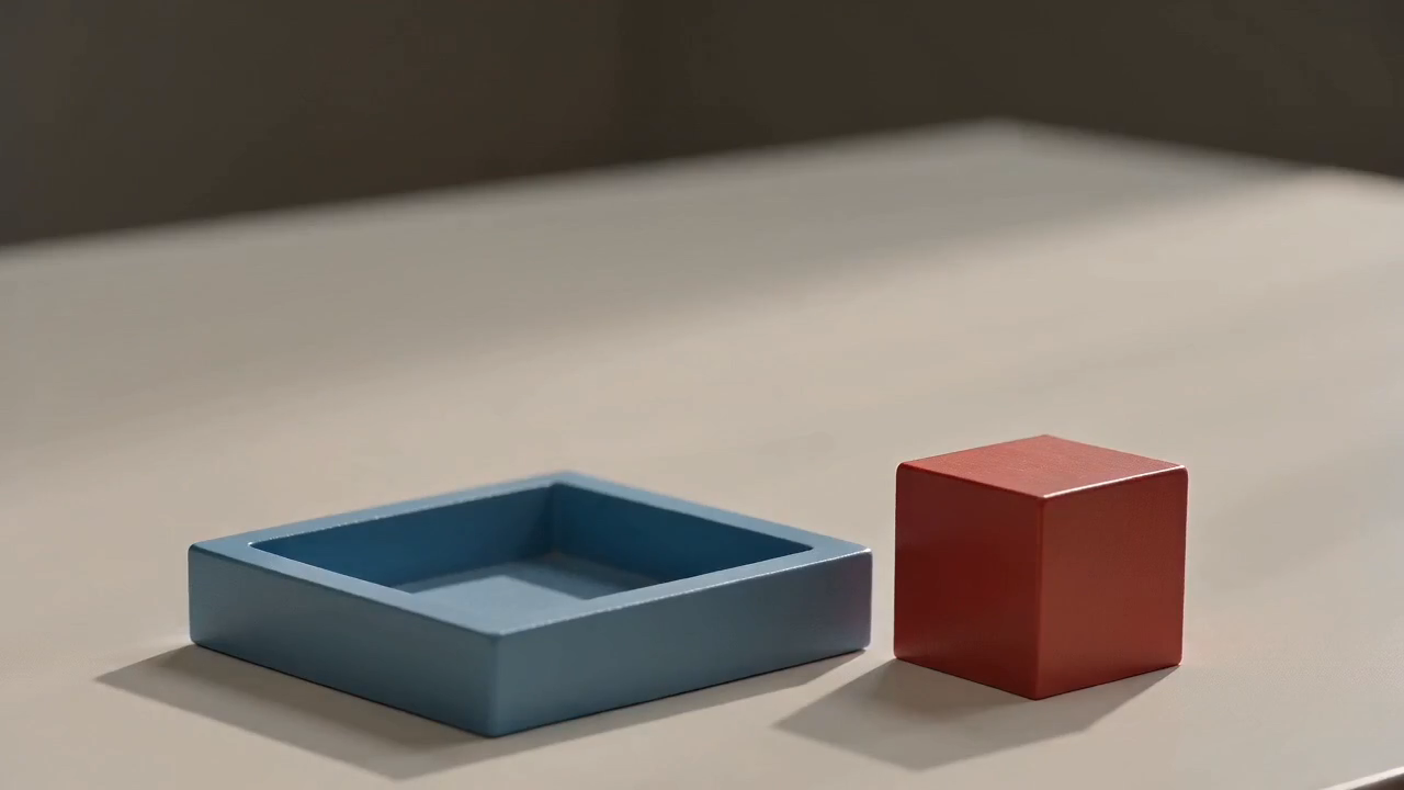 Opening frame from the fuller CapCut export with the red cube outside the empty tray