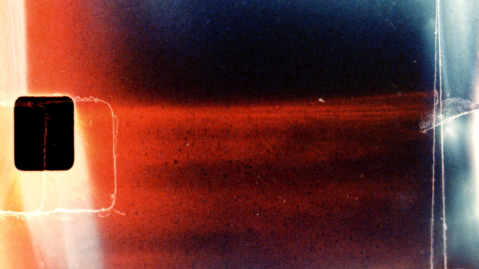 Bright light transition with a film burn dissolve effect