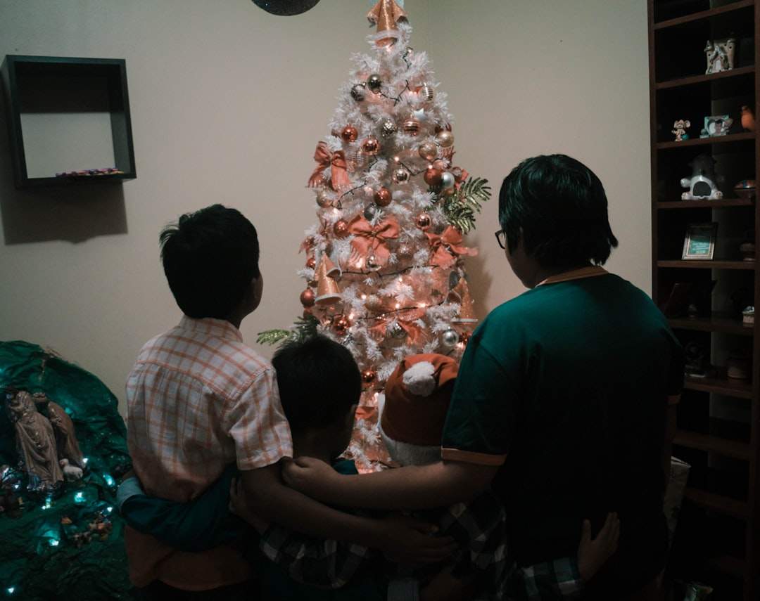 A family gathered around a Christmas tree