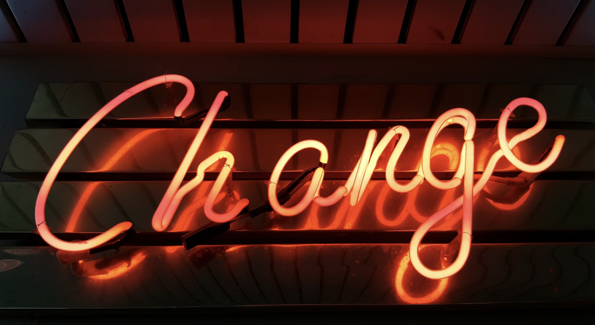 A person standing at a crossroads, symbolizing a new beginning and the power of change quotes.