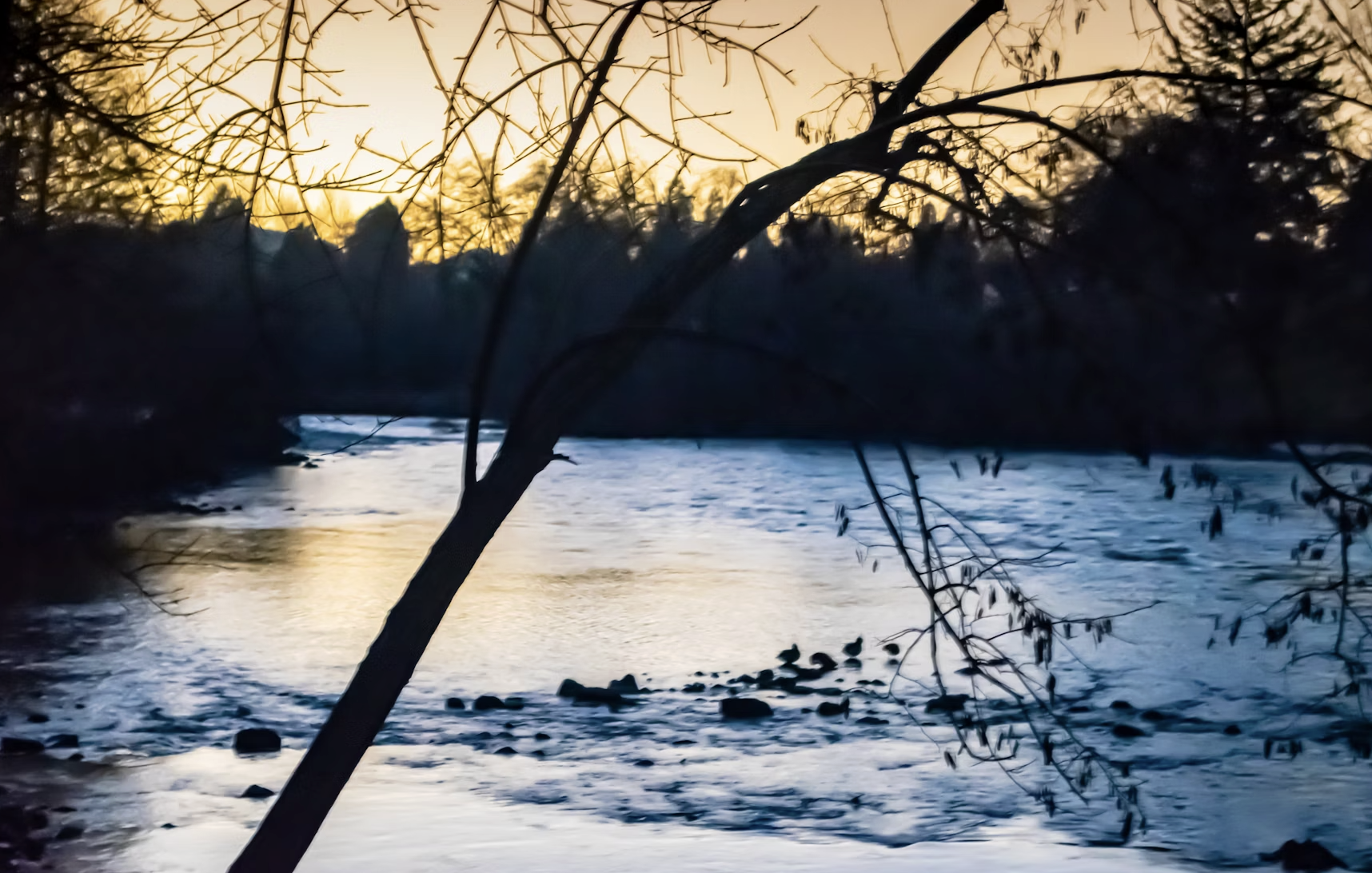 A beautiful image of a sun setting over the ocean with the quote "This too shall pass" subtly overlaid.