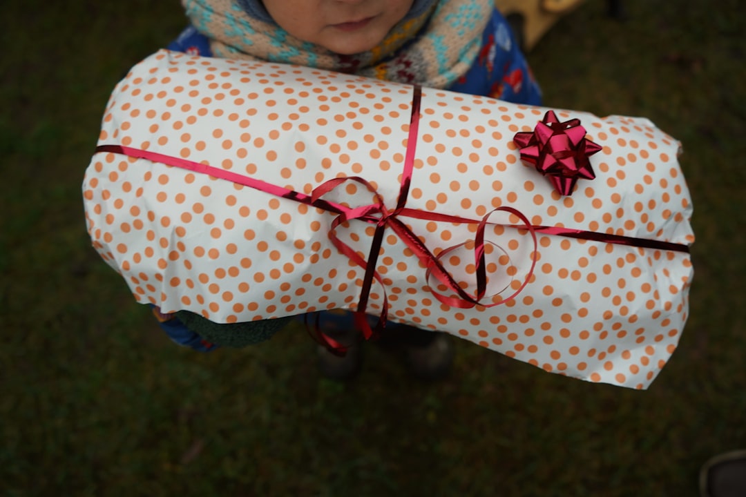 A beautifully wrapped birthday present with a tag that says 'To my wonderful niece'