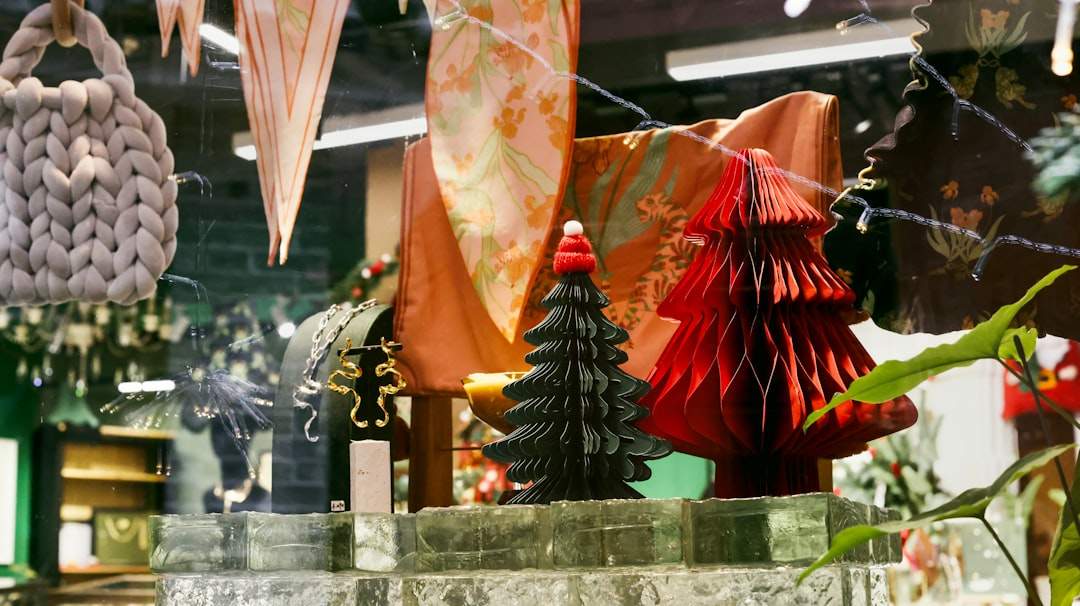 Handmade paper cone Christmas trees arranged on a mantle