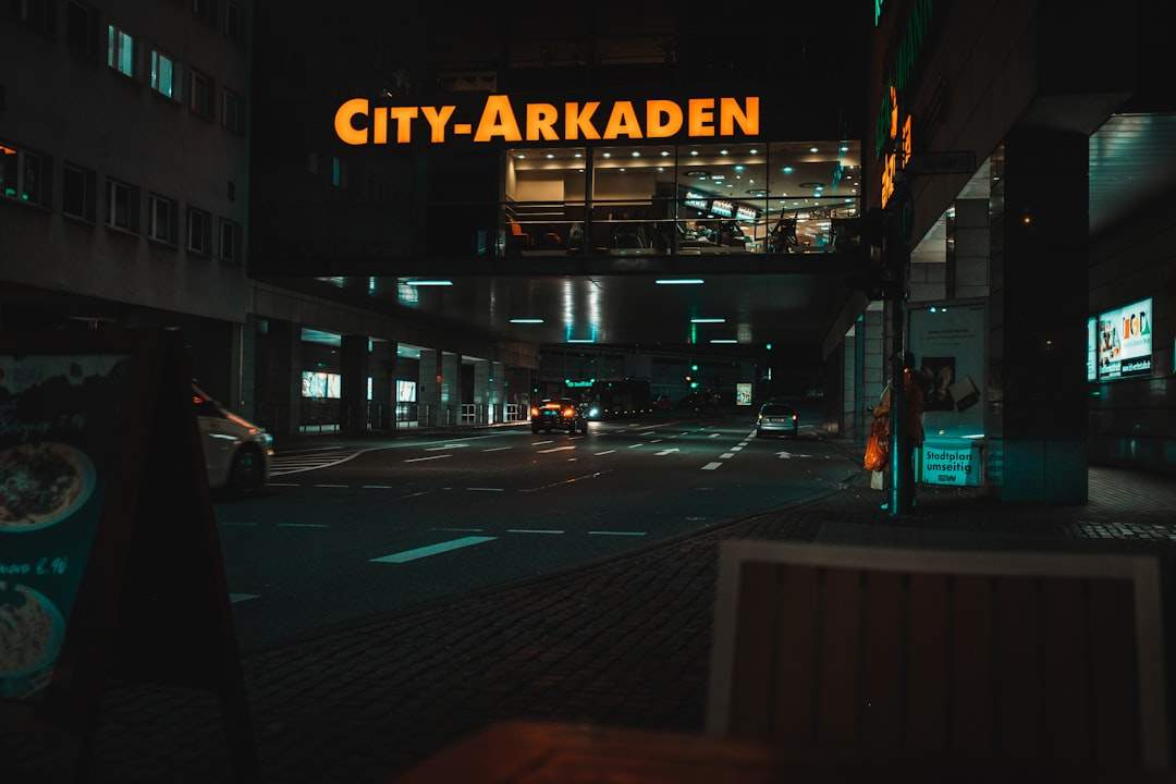 A nighttime cityscape with a cinematic filter, emphasizing neon lights and creating a futuristic feel.