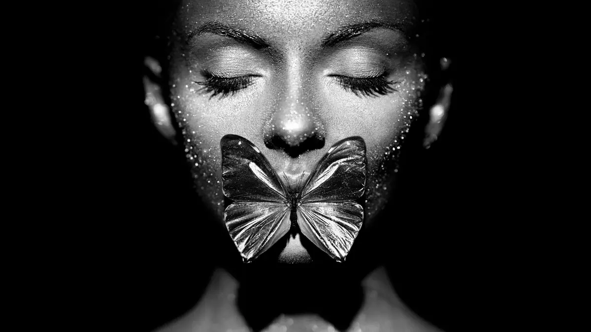 Portrait with controlled butterfly lighting creating deep shadows and depth