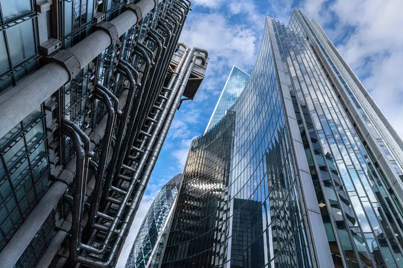 Wide-angle shot of tall buildings and busy streets