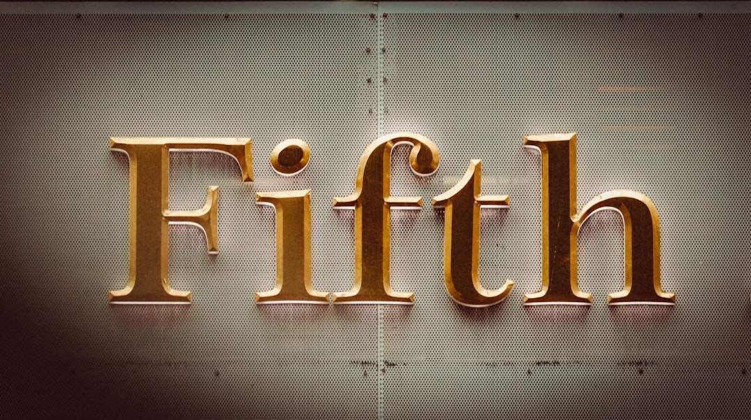 Vertical gold serif title on soft gradient