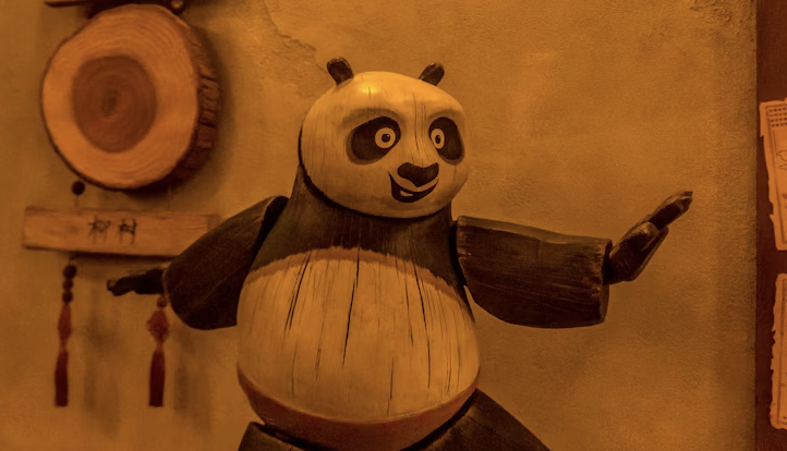 A serene Chinese landscape with misty mountains and a peach blossom tree.