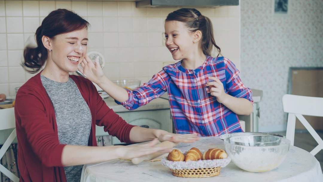 A mother and daughter laughing together.