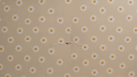 Floral paper with a small tear in the center