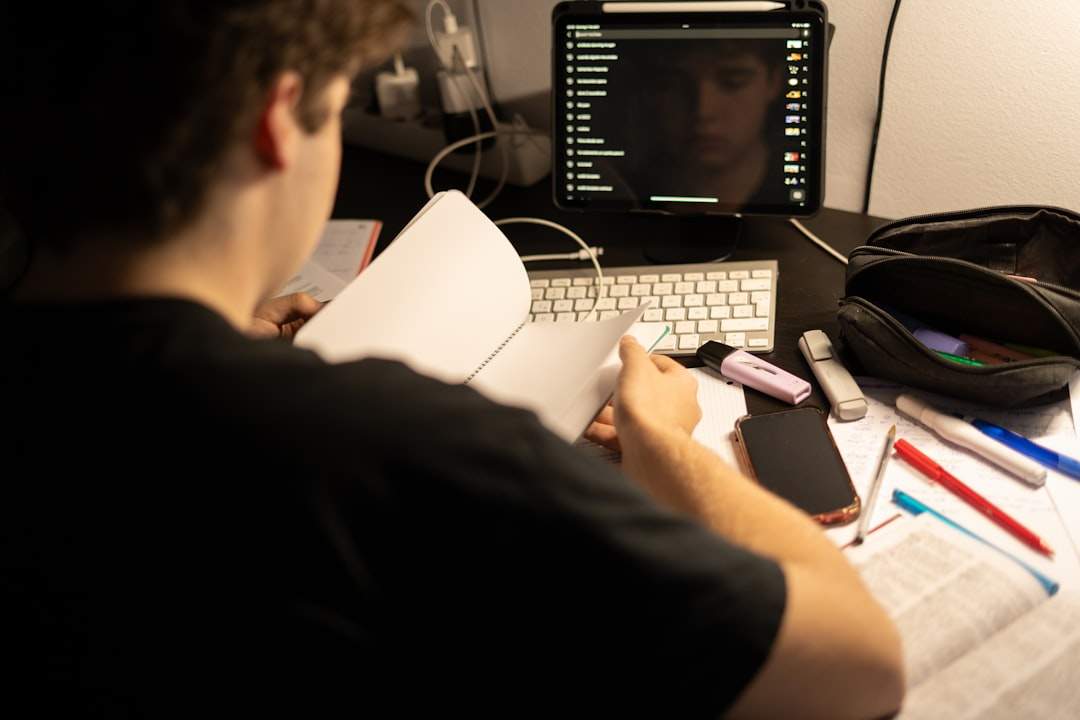 A person looking thoughtfully at a computer screen displaying different video editing software logos.