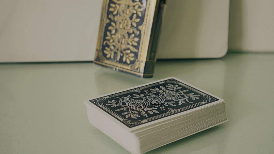 A collection of elegantly designed quote cards with various inspirational sayings on them, scattered on a wooden table.