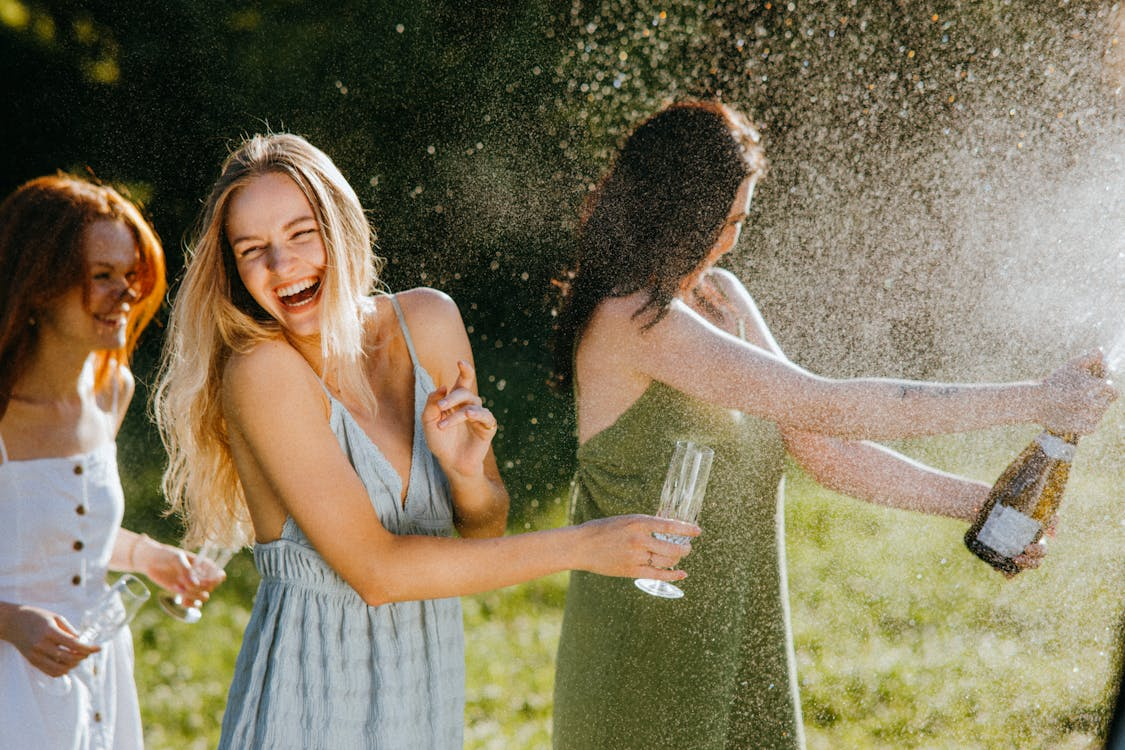 Champagne pop shots with bubbles