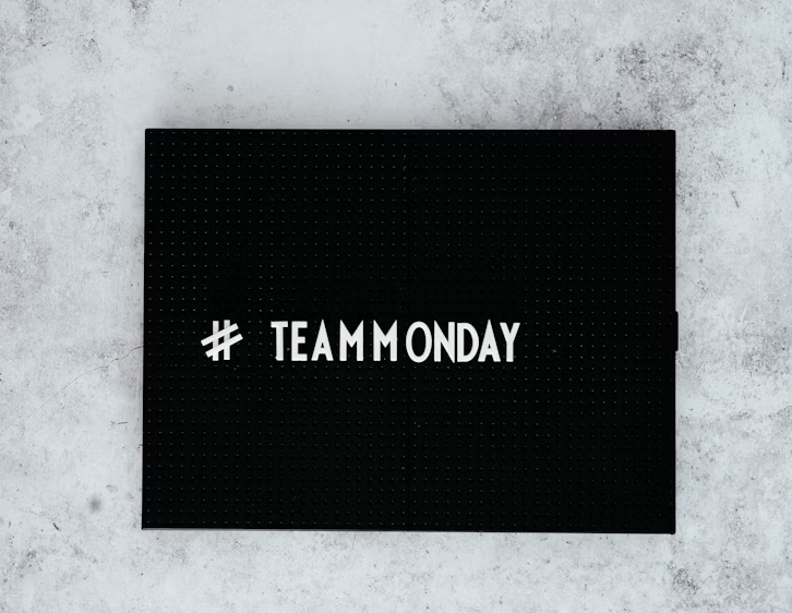 a vibrant and cheerful image with the text "Monday Morning Quotes" in a stylish and eye-catching font. The background could feature a sunrise, a cup of coffee, or other elements that evoke a sense of a fresh start. The overall mood should be positive and uplifting, setting the tone for the article's content.