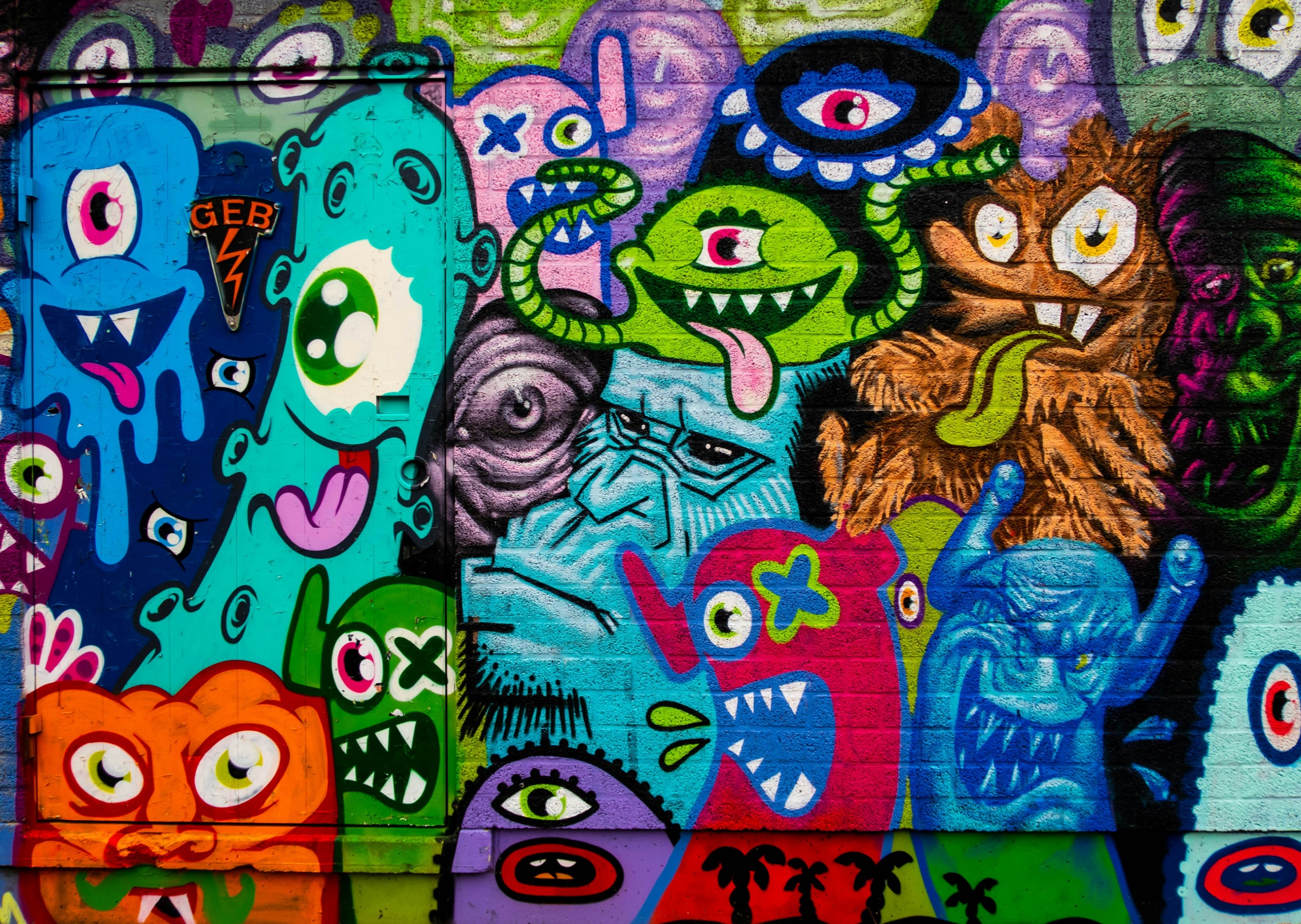 A vibrant street art mural on a brick wall
