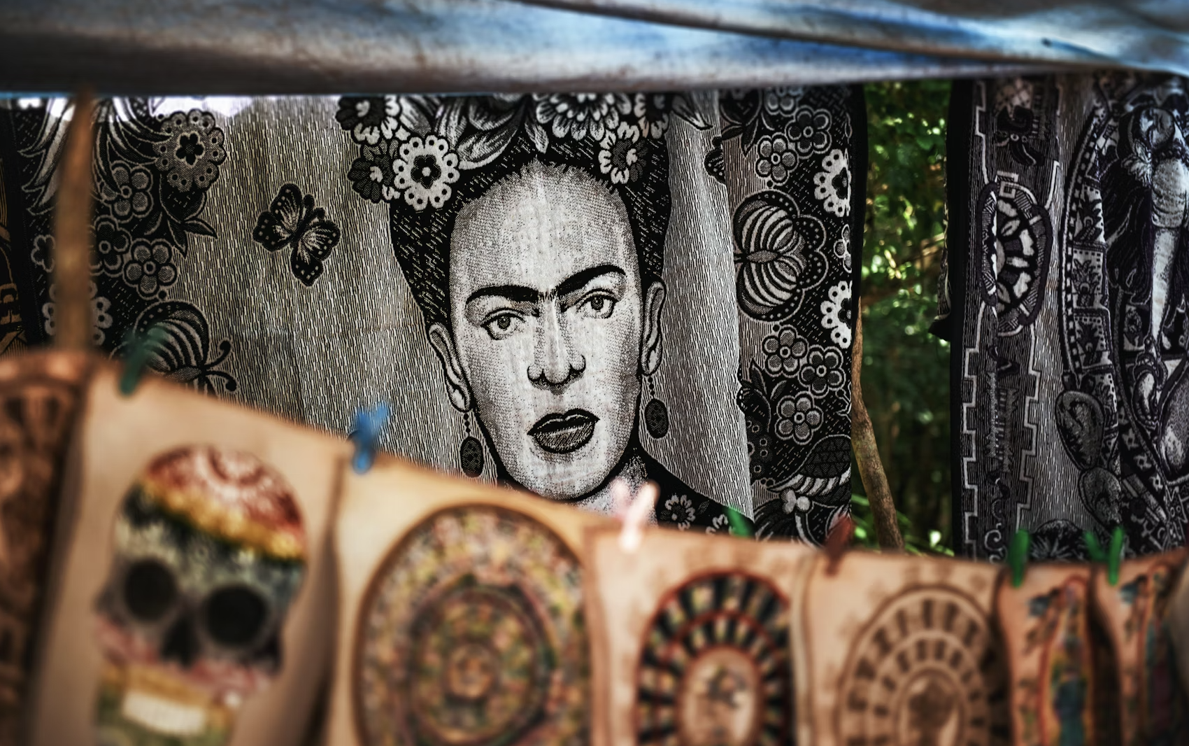 A vibrant and artistic image of Frida Kahlo, surrounded by flowers and symbols from her paintings. The image should be rich in color and detail, capturing her unique style and spirit.