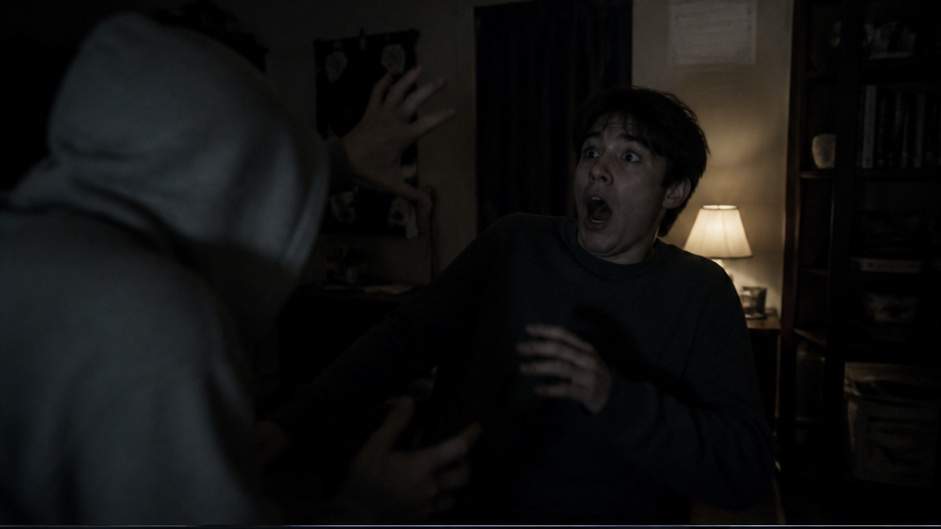 Scare Effects Video — playful non-graphic jump scare in a dim room