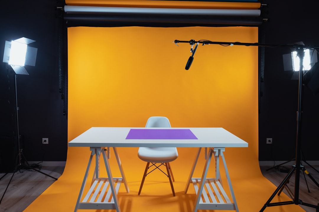Studio product scene with violet gels and chrome props