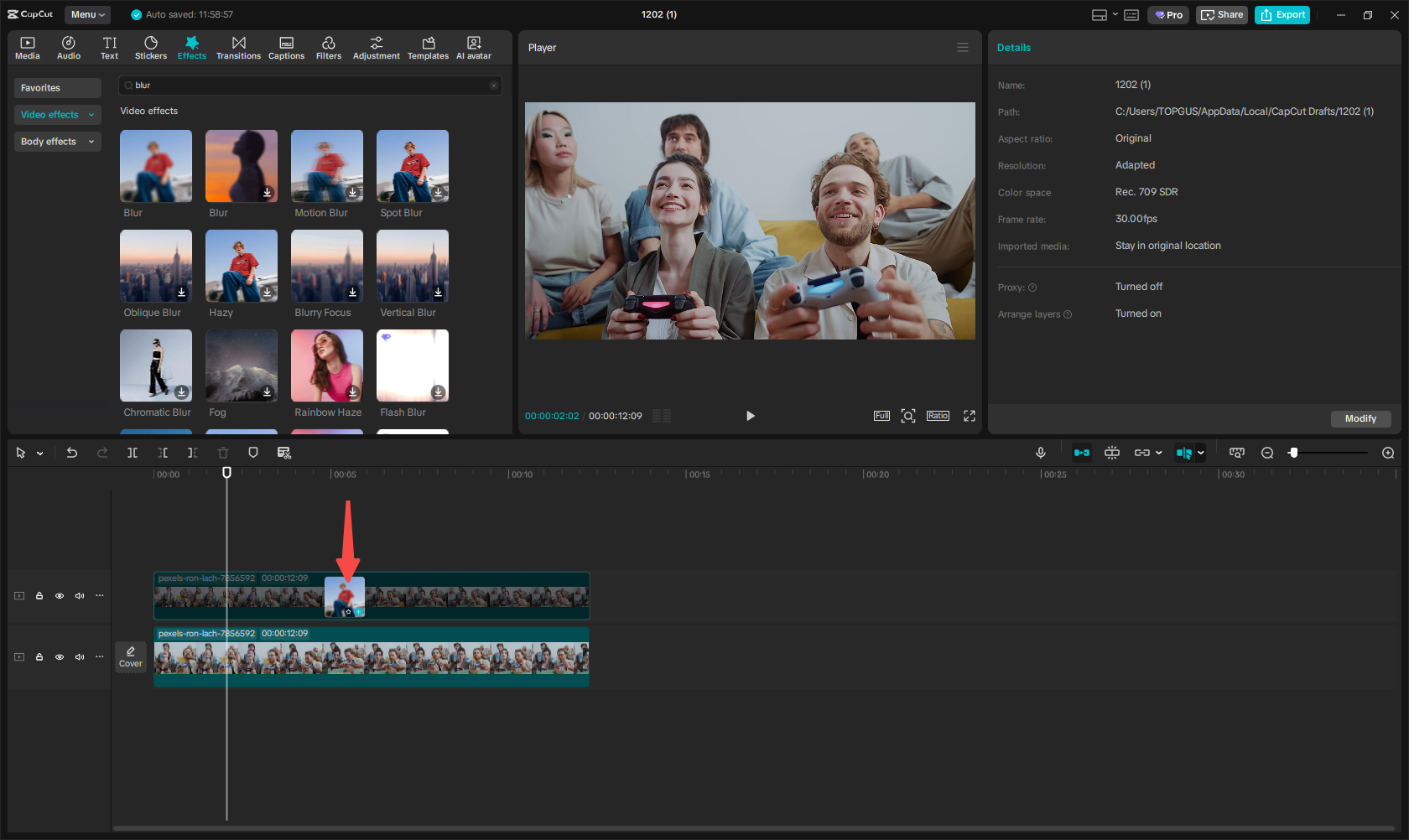 Add a blur effect to the first video layer