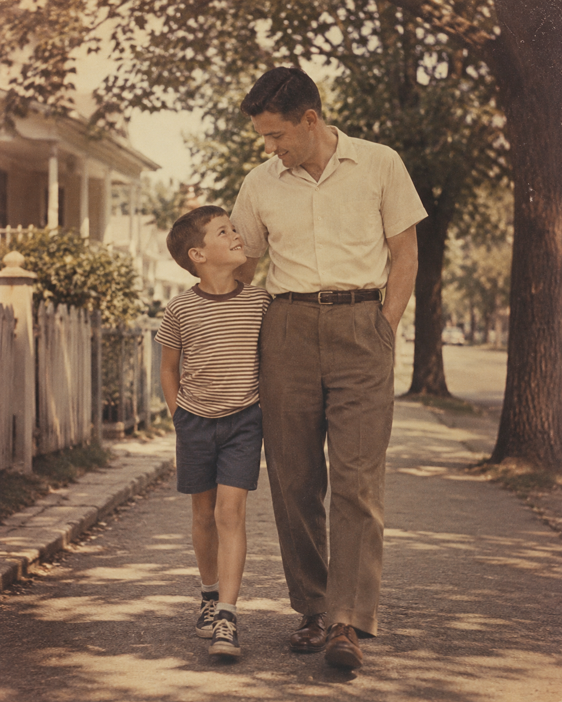 Father's Day picture of a father and child walking together