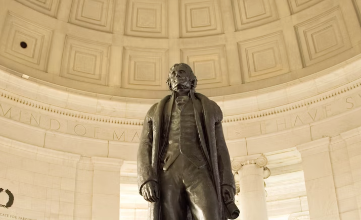 A portrait of Thomas Jefferson with a thoughtful expression, set against a background that evokes a sense of history and wisdom.