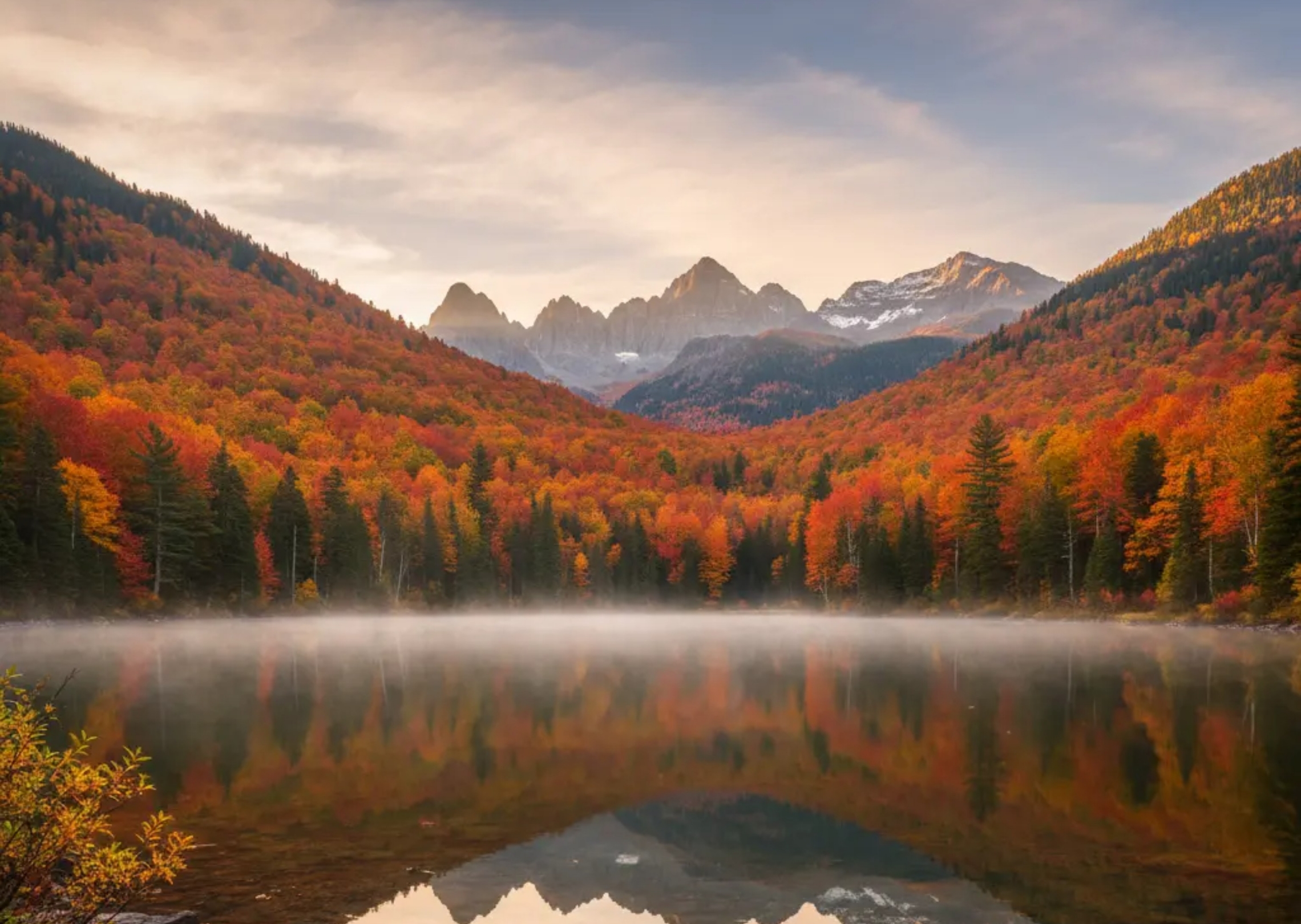A serene mountain lake at sunrise