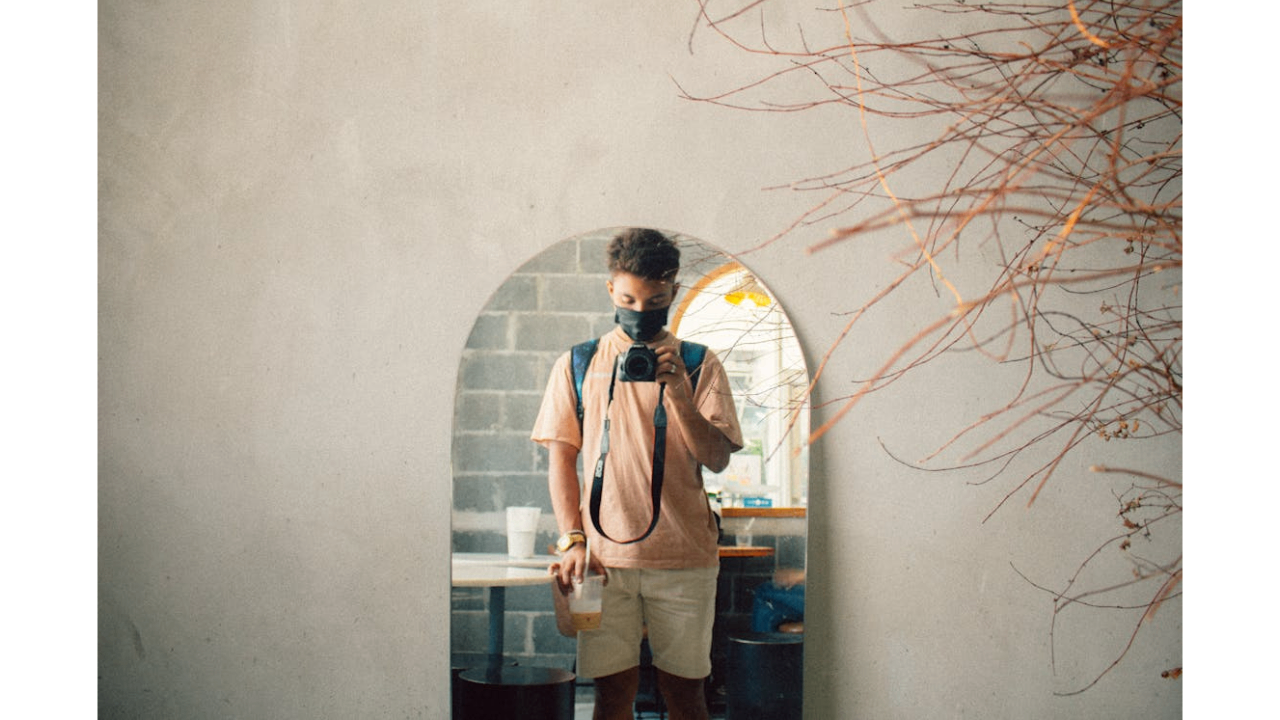 Candid mirror selfie with outfit detail