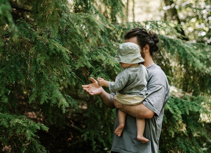 A father and son silhouetted against a sunset, representing the deep bond celebrated with dad quotes.