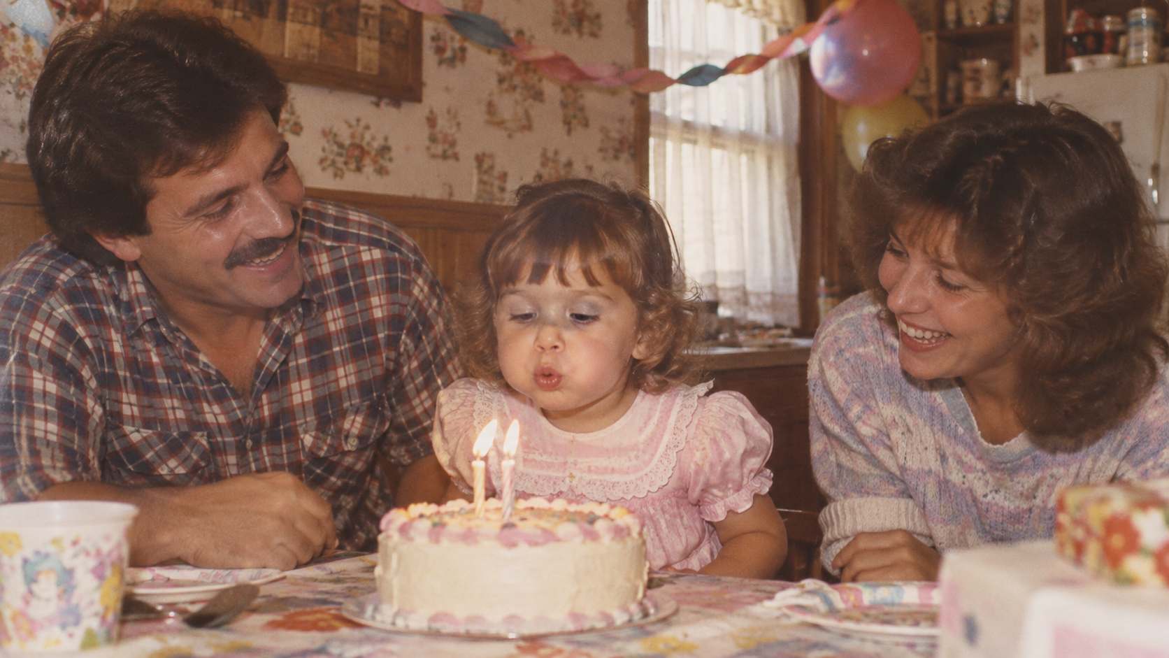 Birthday portrait with parents and a vintage cake