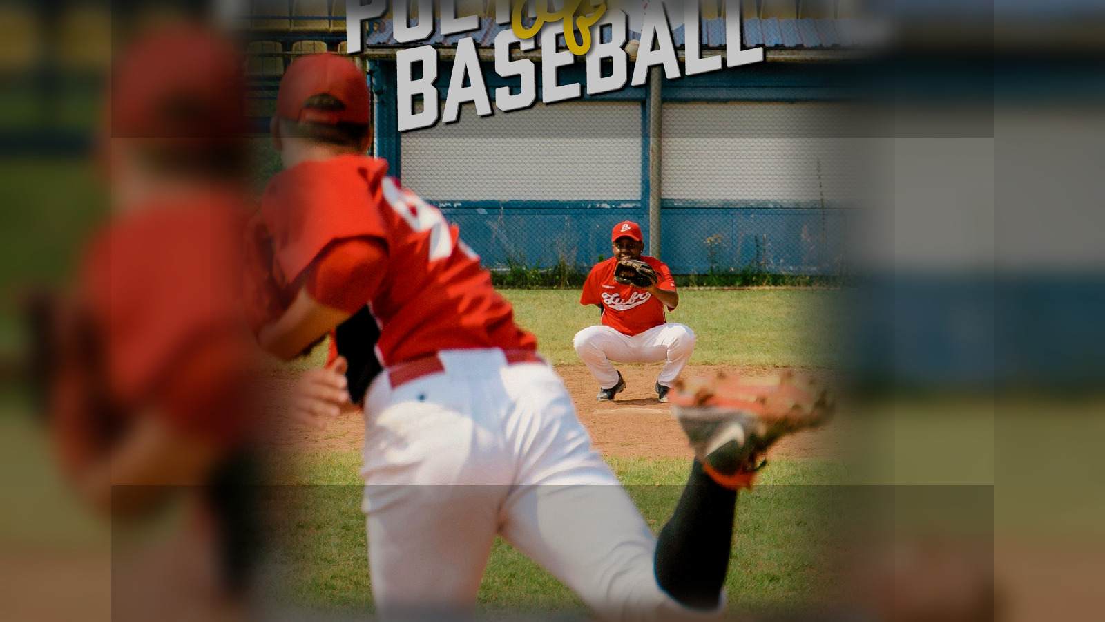 Pitcher and catcher on a baseball field during live gameplay