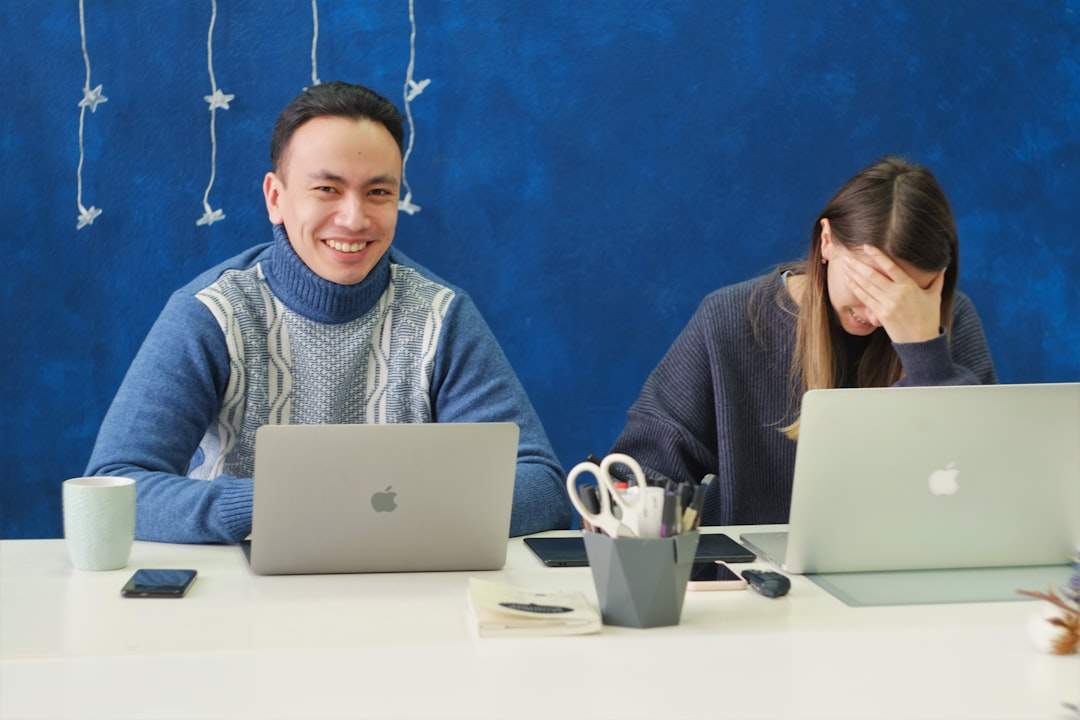 A group of colleagues laughing in an office