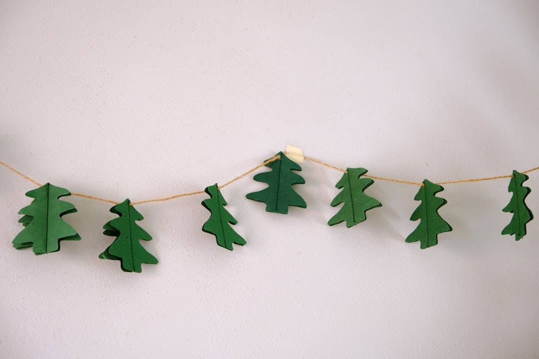 Finished Christmas crafts flat lay including tags, garlands, and 3D paper trees