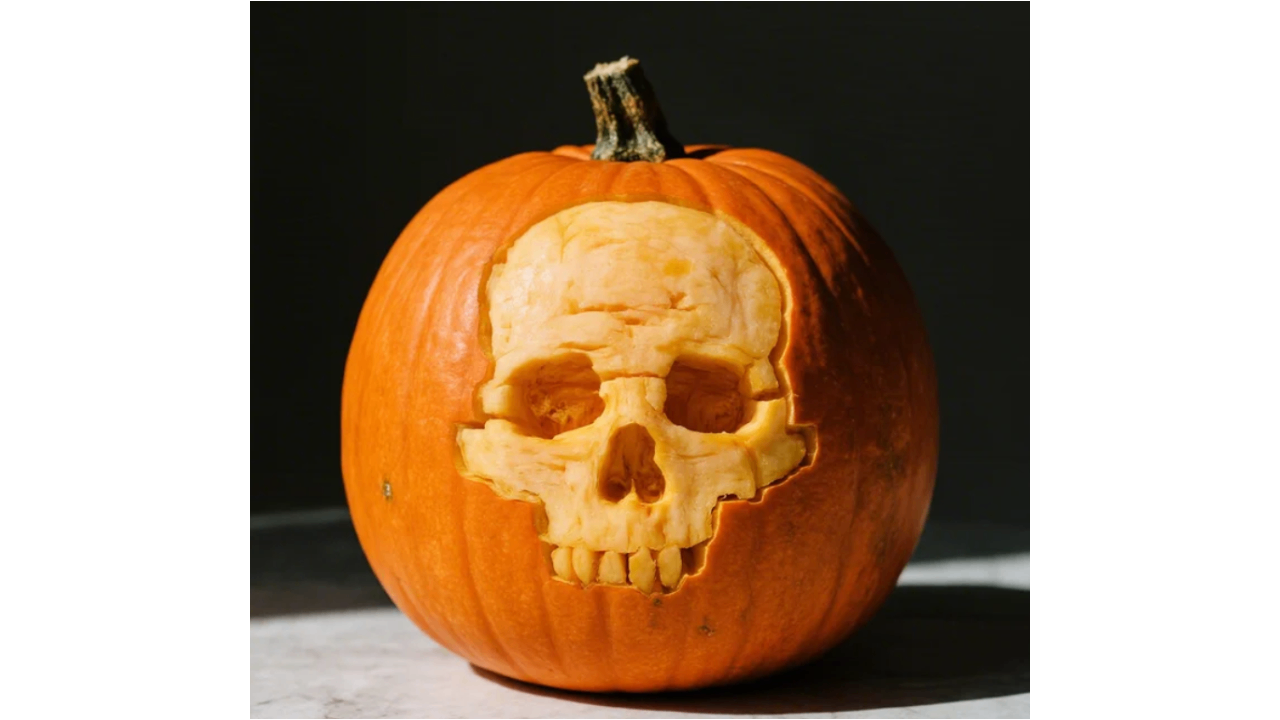 Skull outline carving on pumpkin