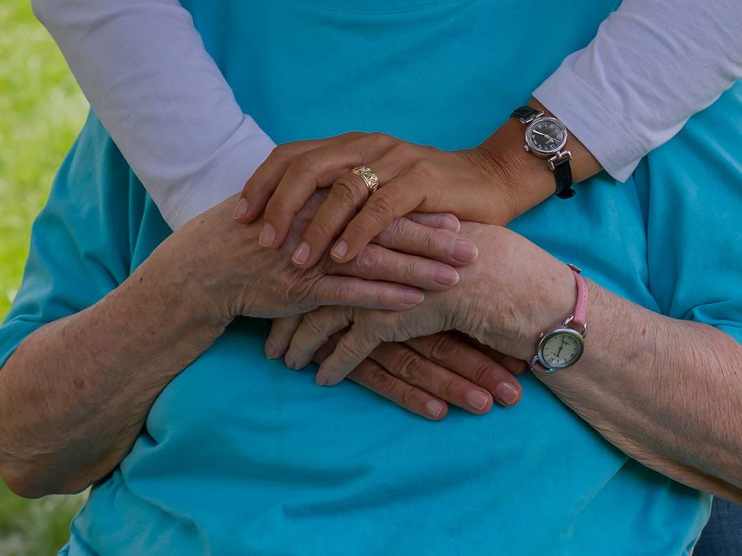 a close-up shot of a mother and daughter holding hands, symbolizing their deep connection