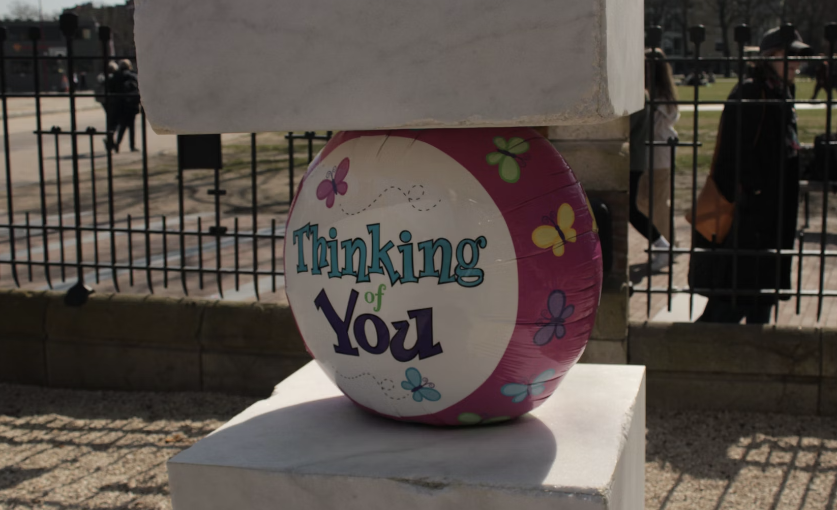 A person sitting by a window looking out thoughtfully, with the text "Thinking of You Quotes" overlaid.