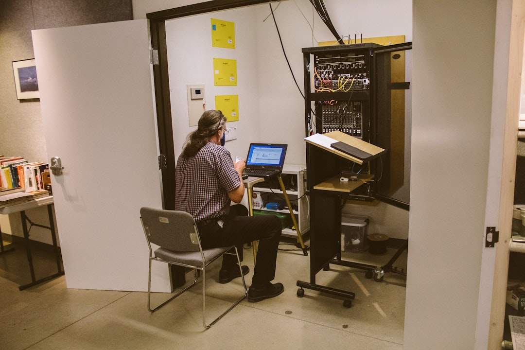 Team collaborating on captioned video deliverables in a workspace